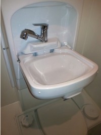 New foldaway sink unit above toilet fitted by Céide Campervan Conversions, Co. Donegal, North-West Ireland